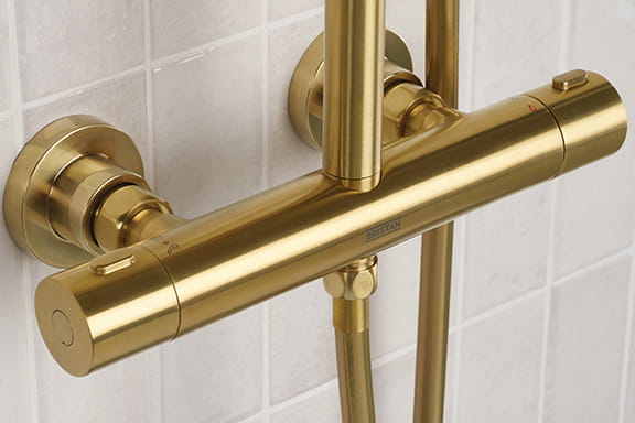 Close up of a Bristan Buzz Bar Shower with Wallmount 12 fixing kit in a Brushed Brass finish