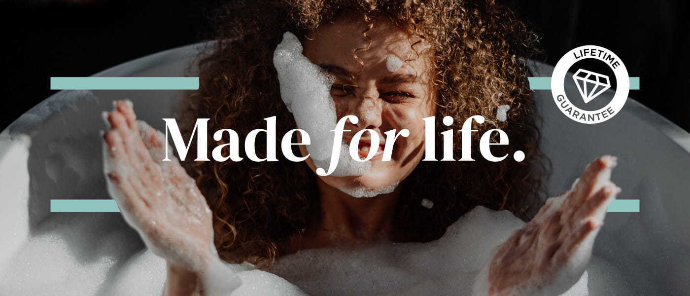 Person relaxing in a bath in a bathroom with Bristan taps, alongside the Bristan Made for life campaign message