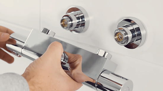 Bristan bar shower being fitted onto the Easyfit Wallmount 12 bracket