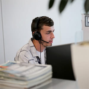 Bristan customer service advisor wearing a headset and helping a customer